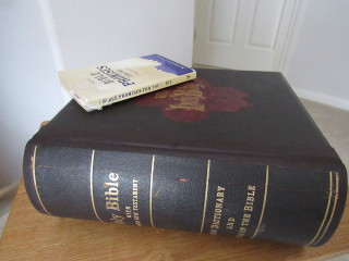 The Wells family Bible from 1882 with the Bible Promises for You book on top